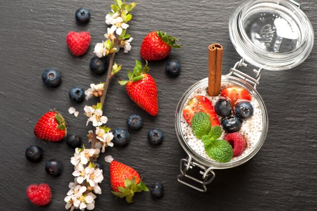 Chia seeds pudding with coconut milk and fresh berries top view