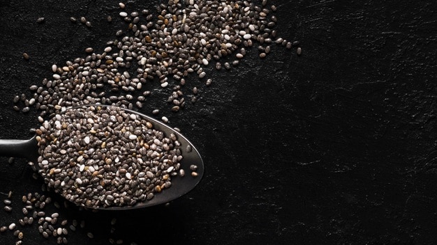 Chia seeds in spoon copy space