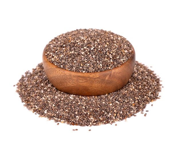 Chia seeds in wooden bowl, isolated on white background.