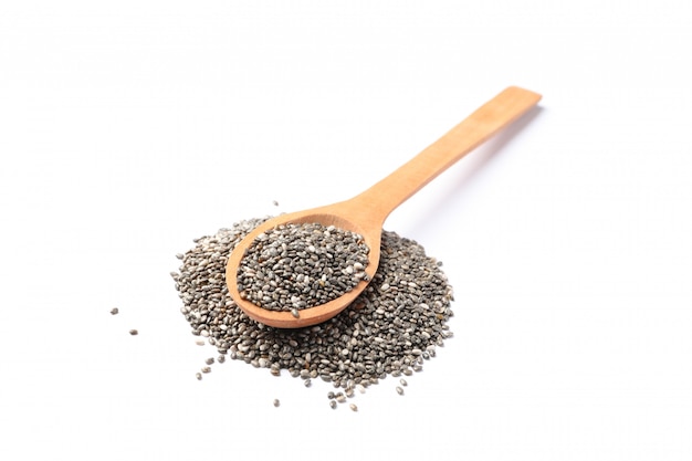 Chia seeds and wooden spoon isolated on white