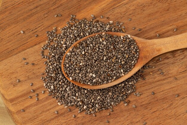 Chia seeds on wooden spoon Selective focus