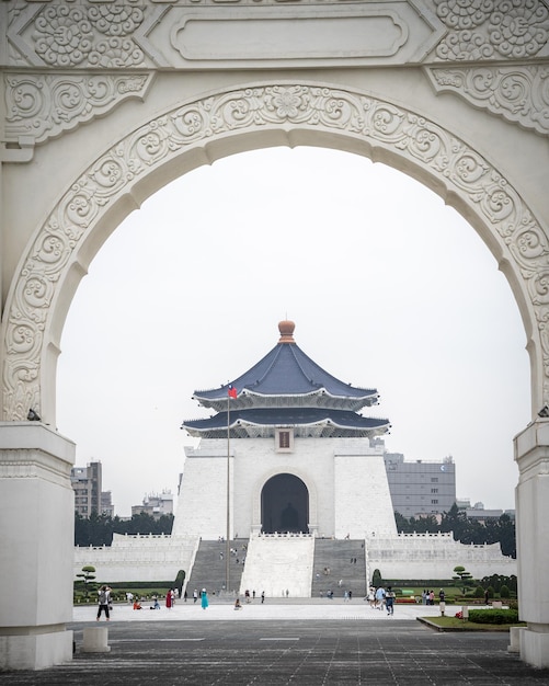 Chiang kaishek memorial hall framed by arc with chinese ornaments vertical taipei taiwan