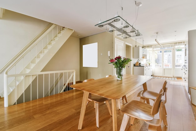 Chic dining room with wooden table and a painting on the wall