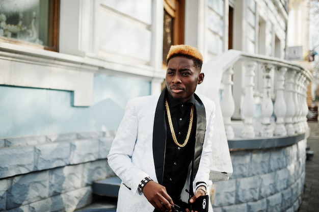 Chic handsome man in white suit.