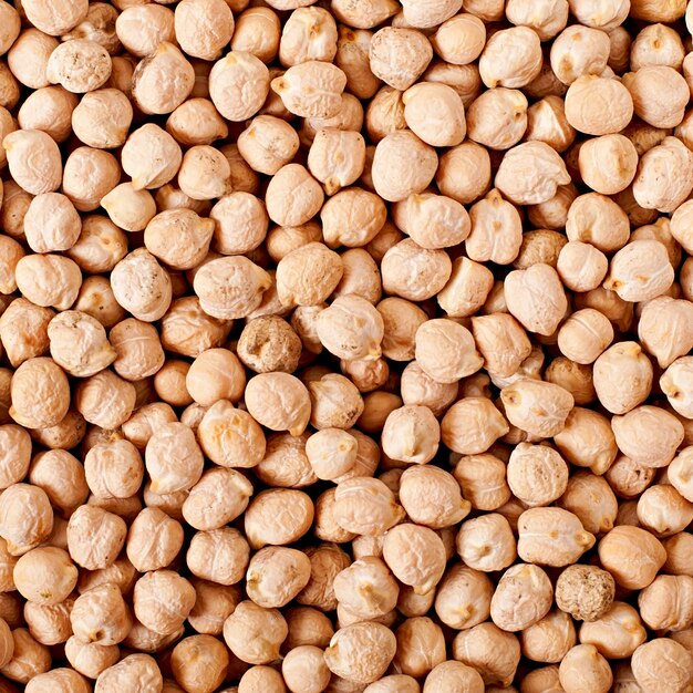 Chick-pea in wooden bowl on wooden surface