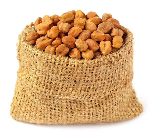 Chick-peas in sack bag over white background