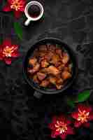Photo chicken adobo meal on black stone surface background generative ai art
