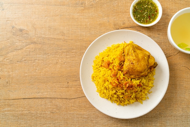 Chicken Biryani or Curried rice and chicken - Thai-Muslim version of Indian biryani, with fragrant yellow rice and chicken - Muslim food style