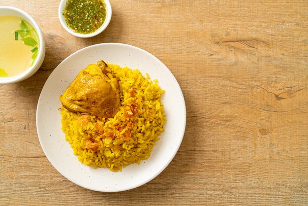 Chicken Biryani or Curried rice and chicken - Thai-Muslim version of Indian biryani, with fragrant yellow rice and chicken - Muslim food style