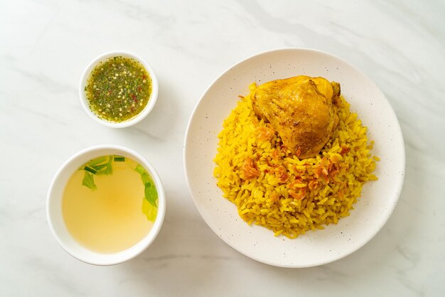 Chicken Biryani or Curried rice and chicken - Thai-Muslim version of Indian biryani, with fragrant yellow rice and chicken - Muslim food style