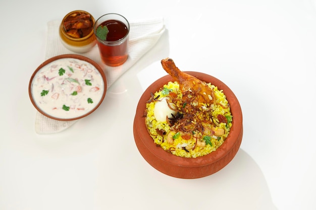 Chicken biryani  made using jeera rice and spices arranged in an earthenware