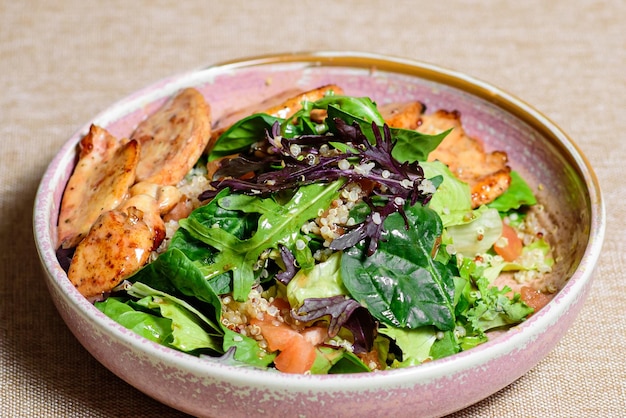 Chicken breast salad with arugula and cherry tomatoes