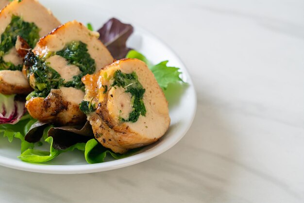 Photo chicken breast stuffed with cheese and spinach