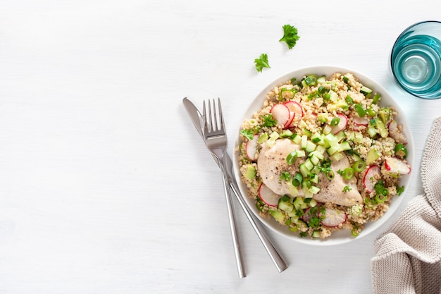 Chicken breast with couscous, cucumber, avocado, spring onion, radish. healthy lunch