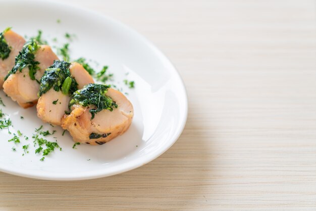 Chicken breasts stuffed with spinach and cheese on plate