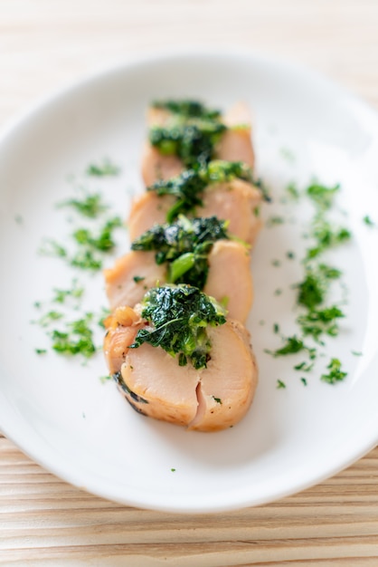 Chicken breasts stuffed with spinach and cheese on plate