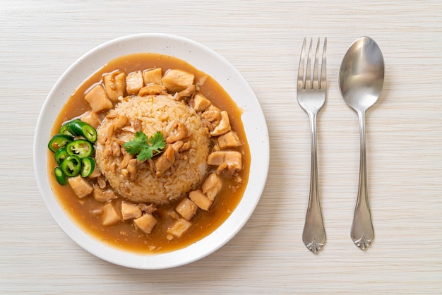 Chicken in brown sauce or gravy sauce with rice - Asian food style