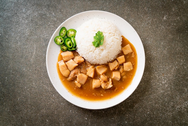 Chicken in brown sauce or gravy sauce with rice - Asian food style