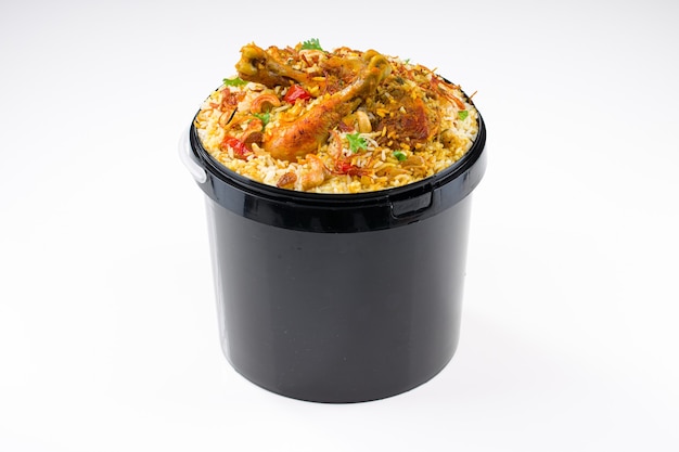 Chicken Bucket Biryani Kerala dum chicken biryani arranged in a black bucket container