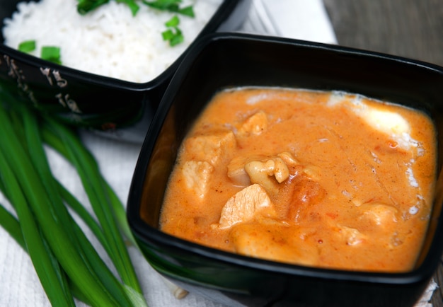 Chicken curry in a bowl with rice