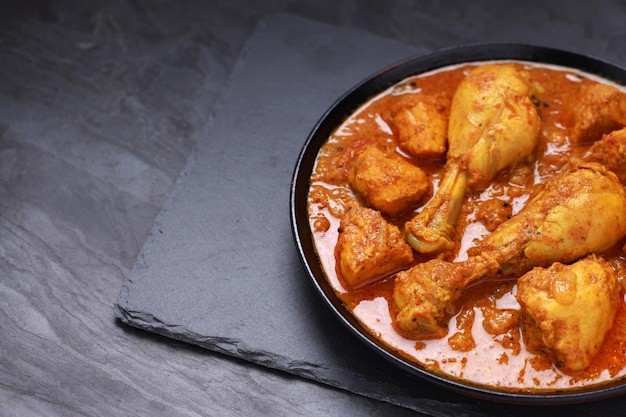 Chicken curry or masala Kerala style chicken curry using fried coconut in traditional way