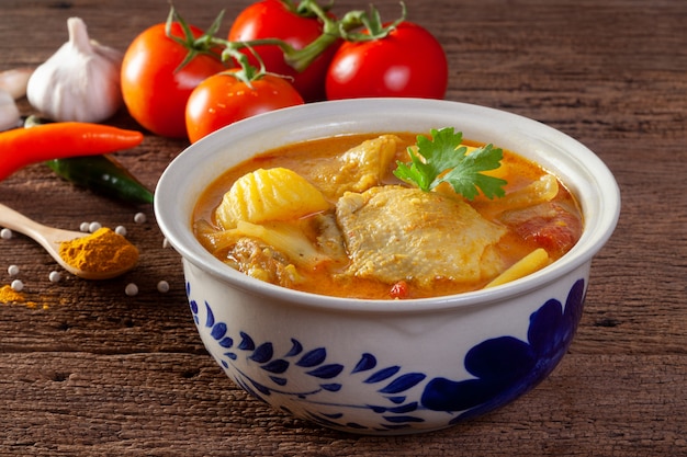 Chicken curry on wooden background