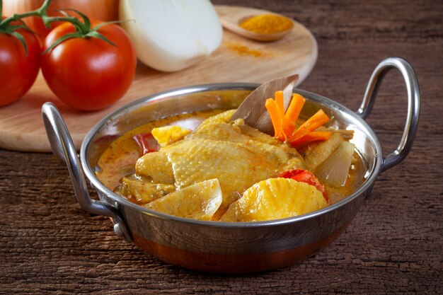 Chicken curry on wooden background