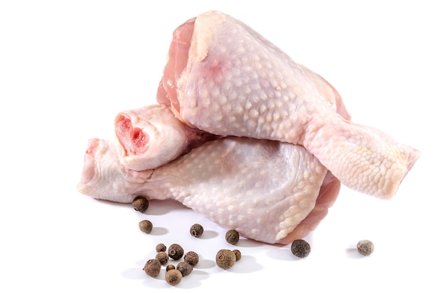 chicken drumsticks on white background