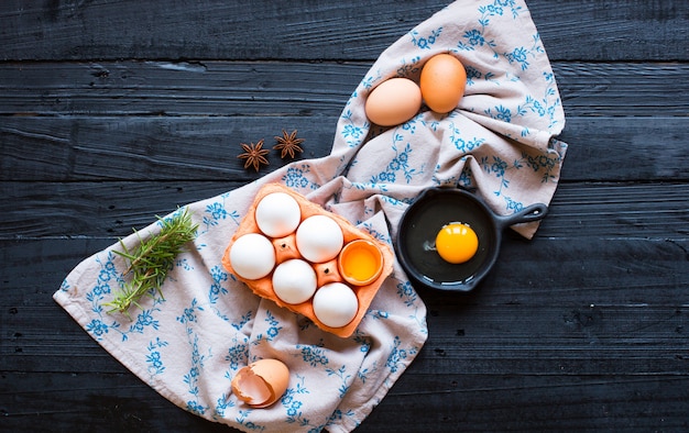 Chicken egg on a dark wooden background