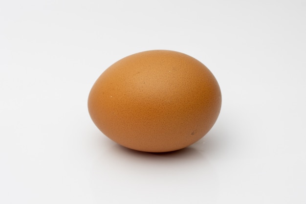 Chicken egg isolated on white close view