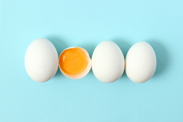 Chicken eggs on a colored background farm products natural eggs