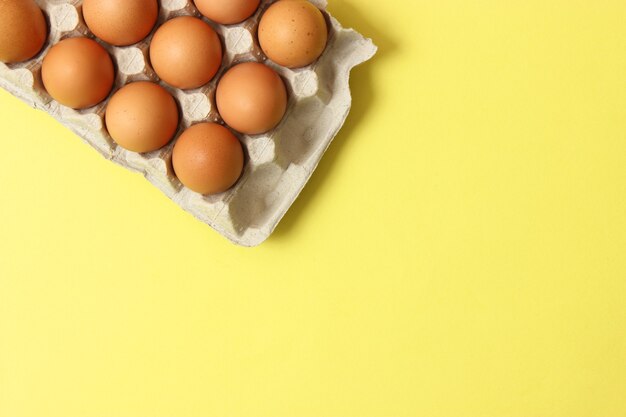 Chicken eggs on a colored background farm products natural eggs