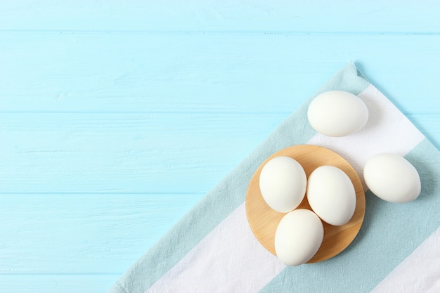 Chicken eggs on a colored background farm products natural eggs