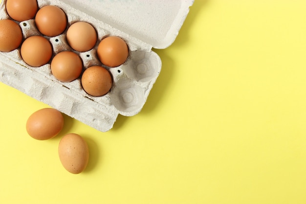 Chicken eggs on a colored background farm products natural eggs