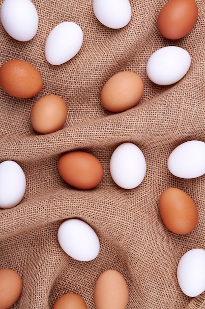 Chicken eggs on a jute sack