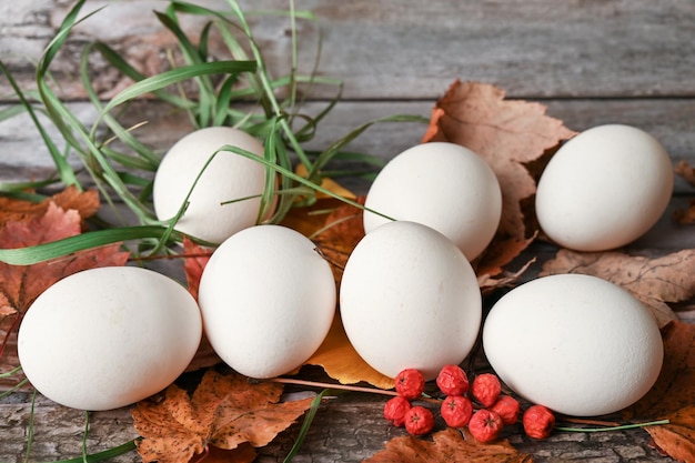 Chicken eggs lie on a wooden table in the kitchen