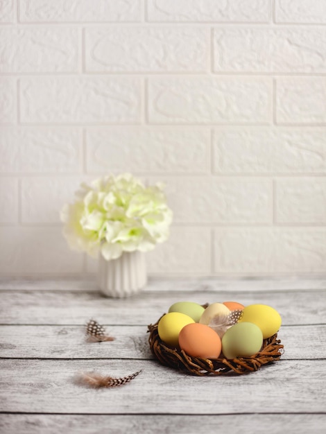 Chicken eggs in nest Home bright interior with Easter decor Minimalistic Easter celebration