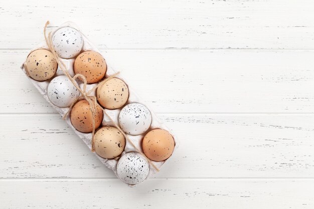 Chicken eggs pack on wooden table