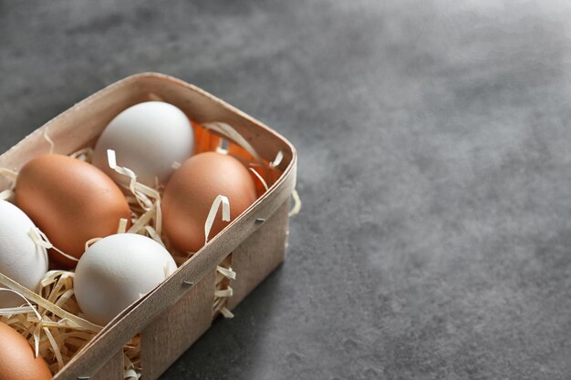 Chicken eggs in package on table