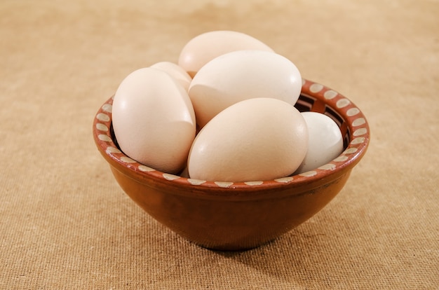 chicken eggs in a plate on the table