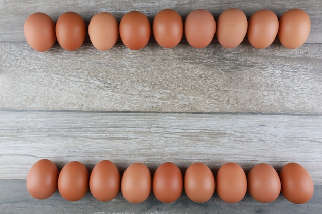 Chicken eggs on vintage wooden table