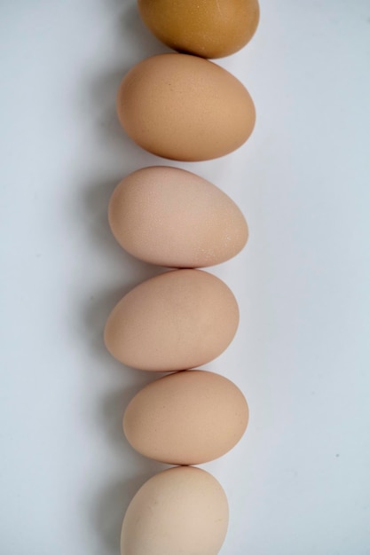 Chicken eggs on white background top view Easter concept