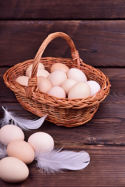 Chicken eggs in a wicker basket 