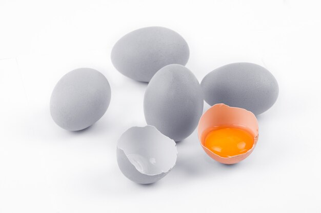 Chicken eggs with broken egg 