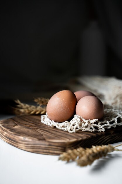 chicken eggs on a wooden board organic natural food ingredients