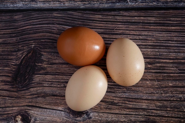 Chicken eggs on a wooden table