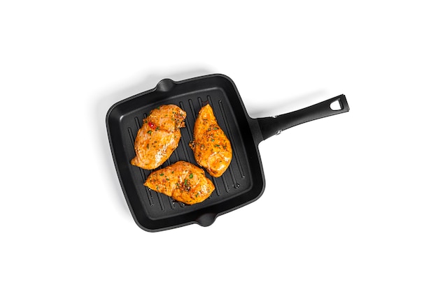 Chicken fillet on grill pan isolated