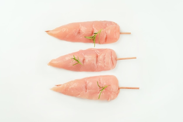 Chicken fillet inner skewersfood concepttop viewskewers from raw chicken meat inner fillet for a sup