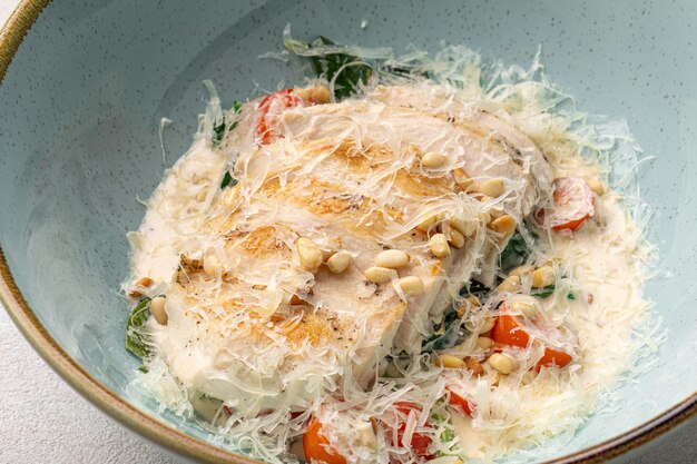 Chicken fillet with parmesan cheese and vegetables