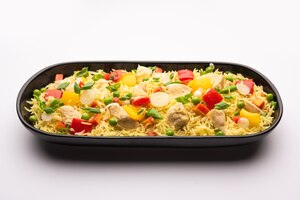 Chicken fried rice is a popular indian chinese or indo-chinese street food served in a plate with chopsticks